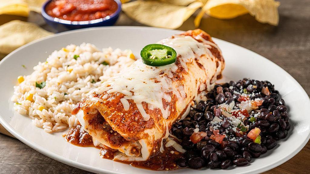 Veggie Burrito (Vegetarian) · Zucchini, squash, bell peppers and Jack cheese rolled in a flour tortilla smothered with roasted red chile tomatillo salsa. Served with cilantro lime rice and black beans or sautéed vegetables.