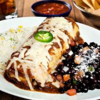 Veggie Chimichanga · Our Veggie Burrito fried crispy and smothered with roasted red chile tomatillo salsa. Served...