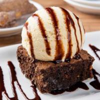 Border Brownie Sundae · Rich chocolate & walnut brownie topped with vanilla ice cream and a chocolate sauce drizzle....