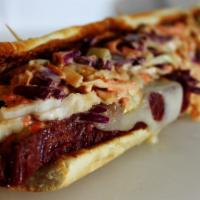 Reuben Sandwich · Pastrami , Swiss cheese, Cole slaw and Russian dressing on rye bread.