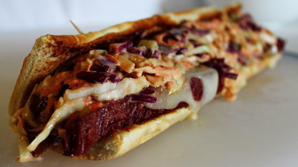 Reuben Sandwich · Pastrami , Swiss cheese, Cole slaw and Russian dressing on rye bread.