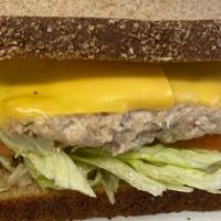 Tuna Melted · melted cheese  on grilled tuna with lettuce and tomato.