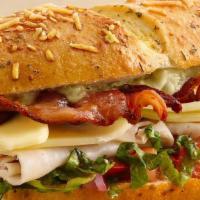 Turkey Club Sandwich · Turkey, bacon, lettuce, tomatoes, and mayo.