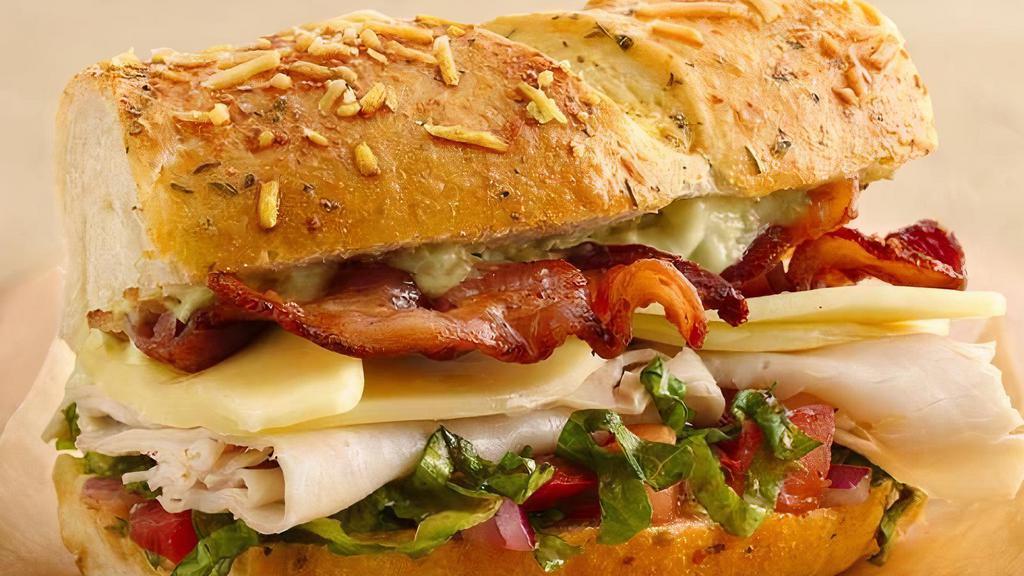 Turkey Club Sandwich · Turkey, bacon, lettuce, tomatoes, and mayo.