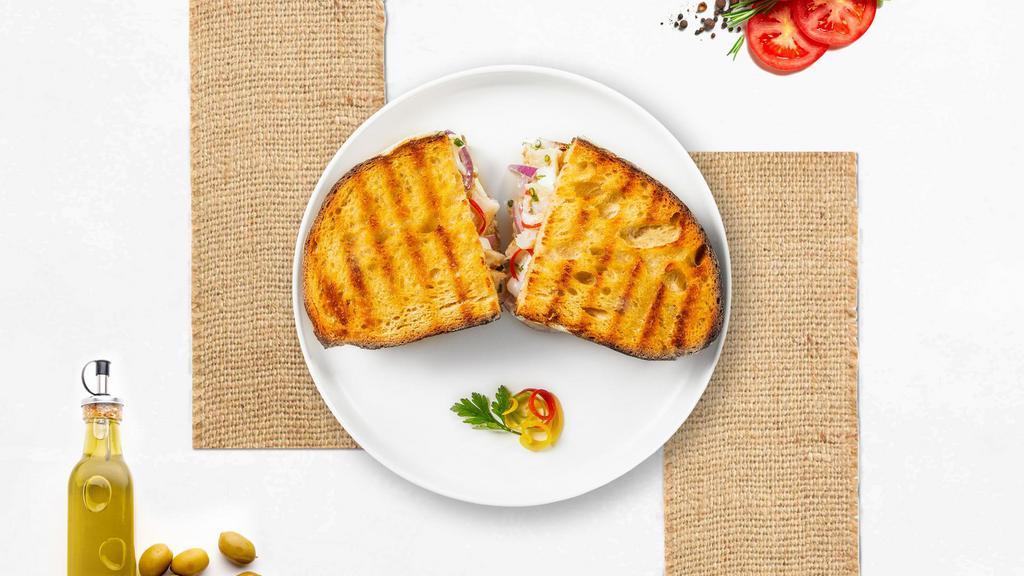 Tuna Melts Panini · Fresh tuna, salad,cheddar cheese, lettuce, and plum tomatoes on toasted bread.