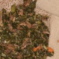 Gomen Besiga · Combination of seasoned prime beef stew and collard greens with garlic, onion, ginger and cu...