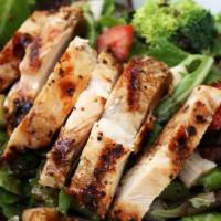 Chicken Salad · Char-grilled chicken breast on top of mixed greens, tomatoes, cucumbers, red onion, corn and...