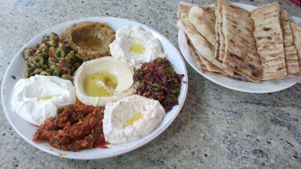 Mix Appetizers · Combination of hummus, babaganoush, eggplant salad, lebni (haydari), acili ezme and staffed grape leaves