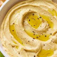 Hummus · Chickpeas mashed into paste with olive oil, lemon juice and flavored with tahini