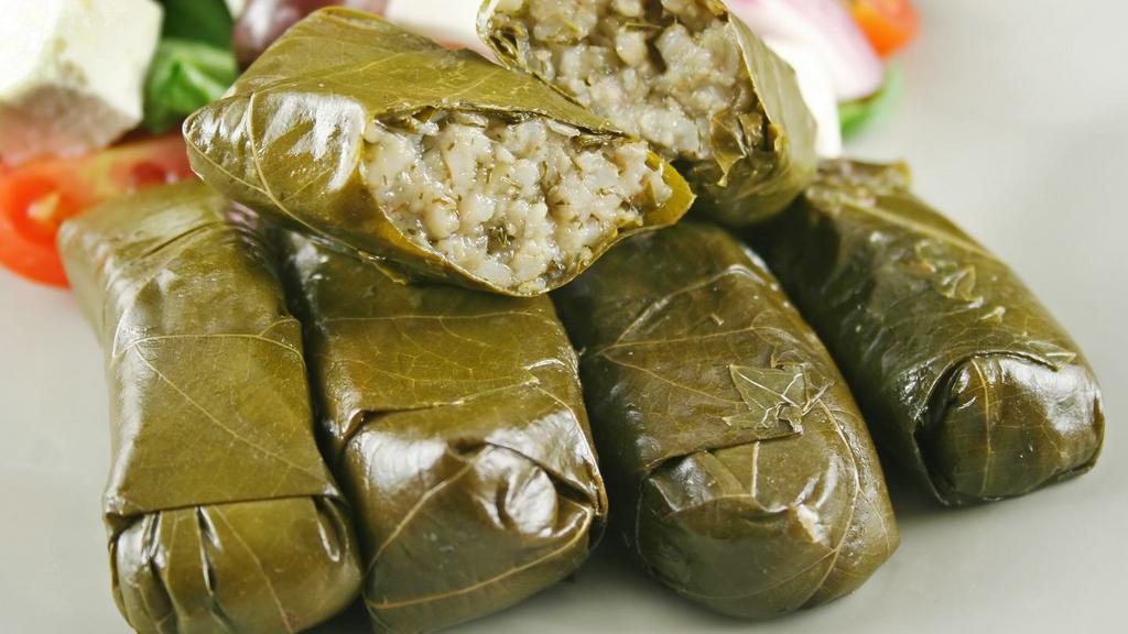 Stuffed Grape Leaves · Yaprak Sarmasi.  Grape leaves staffed with blend of rice, pine nuts, herbs and spices