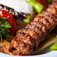 Lamb Adana Kebab · Slightly seasoned hand-chopped lamb flavored with red bell peppers and grilled on skewers. S...