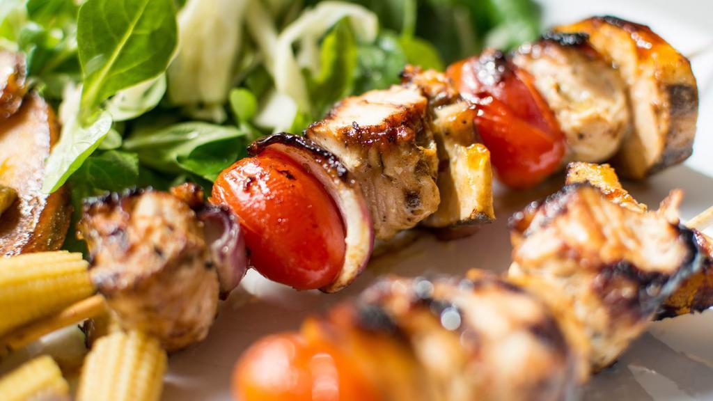 Chicken Shish Kebab · Tender chunks of chicken marinated with our special spices and herbs. Served with rice and house salad