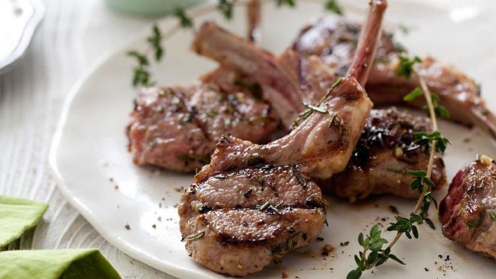 Lamb Chops · Baby lamb chops slightly seasoned with spices and herbs and grilled to order. Served with rice and house salad