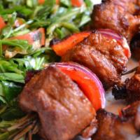 Lamb Shish Kebab · Cubes of baby lamb marinated in our special sauce and char-grilled to delight on skewers. Se...