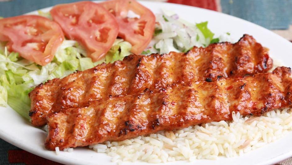 Chicken Adana Kebab · Char-grilled chopped chicken seasoned with spices and herbs. Served with rice and house salad