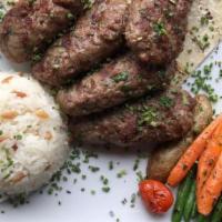 Turkish Meatballs (Kofte) · Ground meat mixed with onions and special spices. Served with rice and house salad