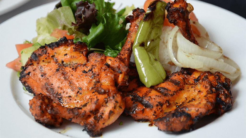 Chicken Chops · Char-grilled chicken leg and thigh. Served with rice and house salad