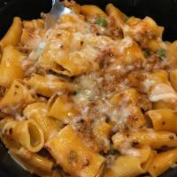 Homemade Rigatoni · crumbled sausage, onions, peas, pink cream sauce, with crusted red pepper & shaved parmigian...