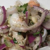 Seafood Salad · A mixture of fresh marinated seafood with a lemon and extra virgin olive oil dressing.
