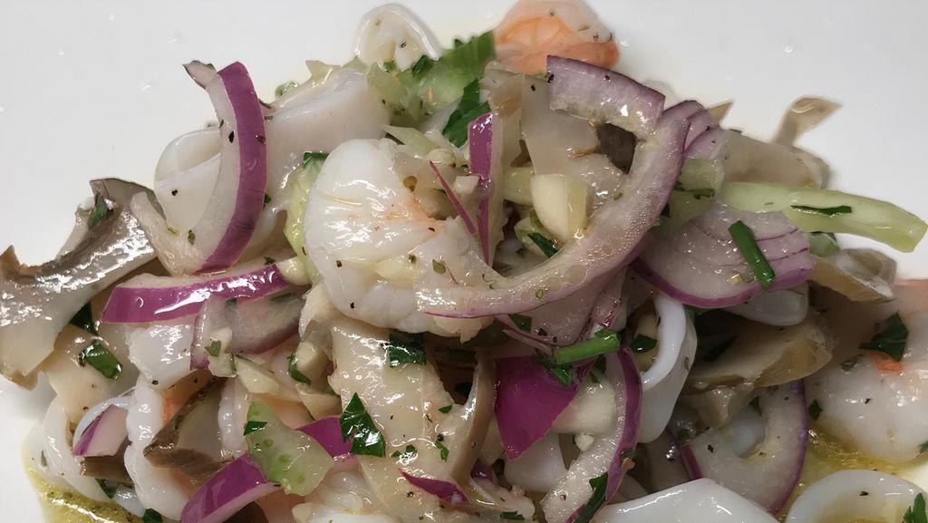 Seafood Salad · A mixture of fresh marinated seafood with a lemon and extra virgin olive oil dressing.