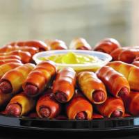 Mini Dogs Party Tray · An all-American classic done Philly Pretzel style! 72 all beef mini pretzel dogs plus 2 of o...