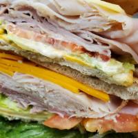 Monte Cristo · Ham, turkey, melted swiss, cheddar, coleslaw, and Russian dressing.