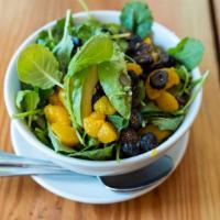 Kipos Salad · Local kale, avocado, oranges, dried figs, cashews, Greek asiago cheese, topped with olive oi...