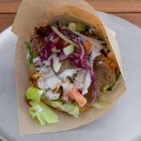 Doner Sandwich · Choice of meat on fresh baked bread with veggies and yogurt garlic sauce