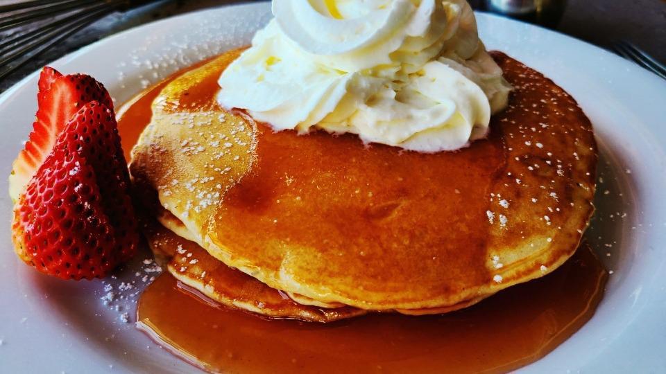 Simply Pancakes · Butter, syrup, powder sugar.