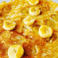 Banana Pancake · Banana pancake with chantilly sauce.
