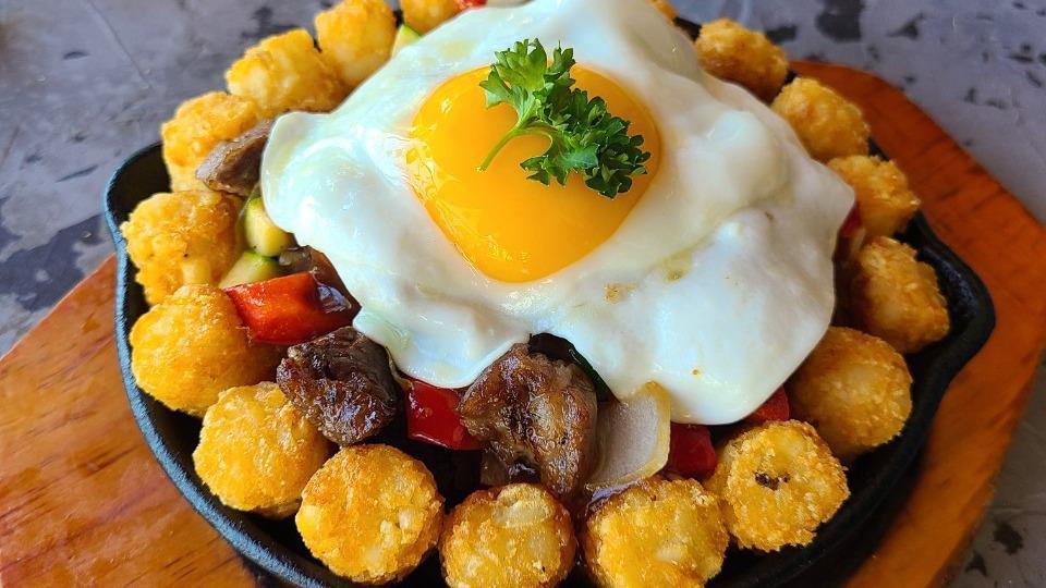 Breakfast Skillet · Tater tots, Portuguese sausage, spam, bell pepper, zucchini, onion, egg, brown gravy.

Consuming raw or undercooked foods may increase risk of foodborne illness.