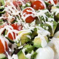 Cobb Salad · Bacon, eggs, mixed greens, chicken, tomato, avocado, cucumber, blue cheese, ranch dressing.