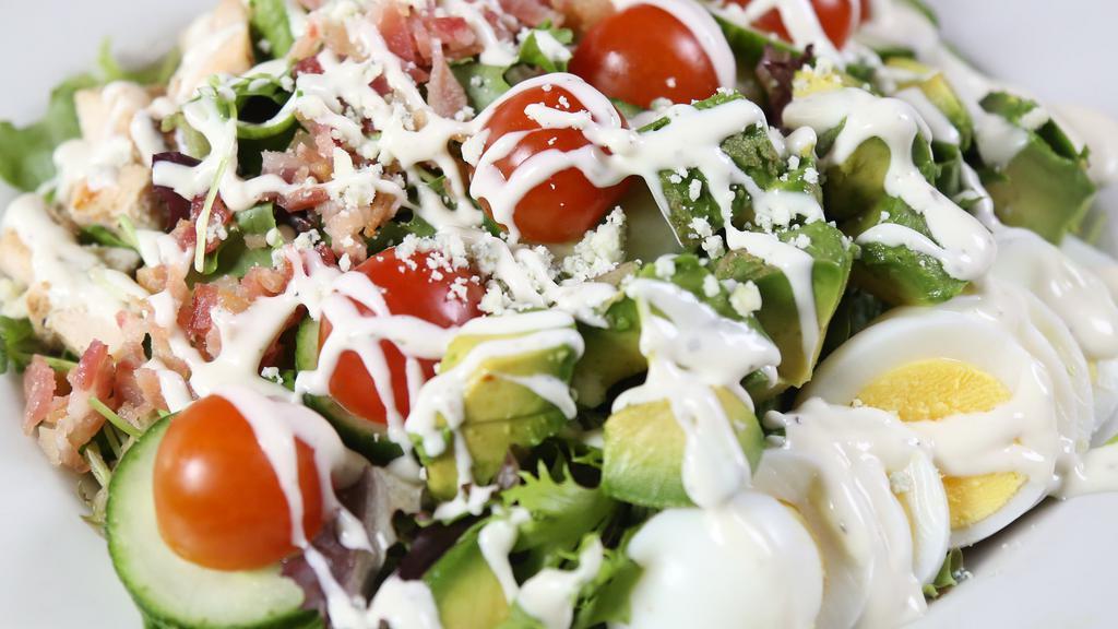 Cobb Salad · Bacon, eggs, mixed greens, chicken, tomato, avocado, cucumber, blue cheese, ranch dressing.