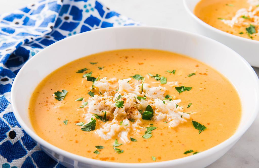 Crab Bisque · Crab bisque is a creamy soup made with crabmeat, and the stock made from shell of these crustaceans while the meat is incorporated into finished soup
