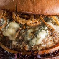Blue Cheese Burger · Onions, signature blue cheese sauce on a Brioche Bun.