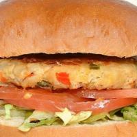 Tuna Burger · Tuna patty, red and green peppers, onions, lettuce and tomatoes on a brioche bun with fresh ...