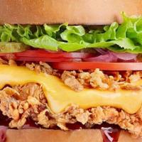 Mississippi Chicken Sandwich · Crispy / Grilled, Lettuce, tomato, cheddar cheese, Honey BBQ sauce on a brioche bun.