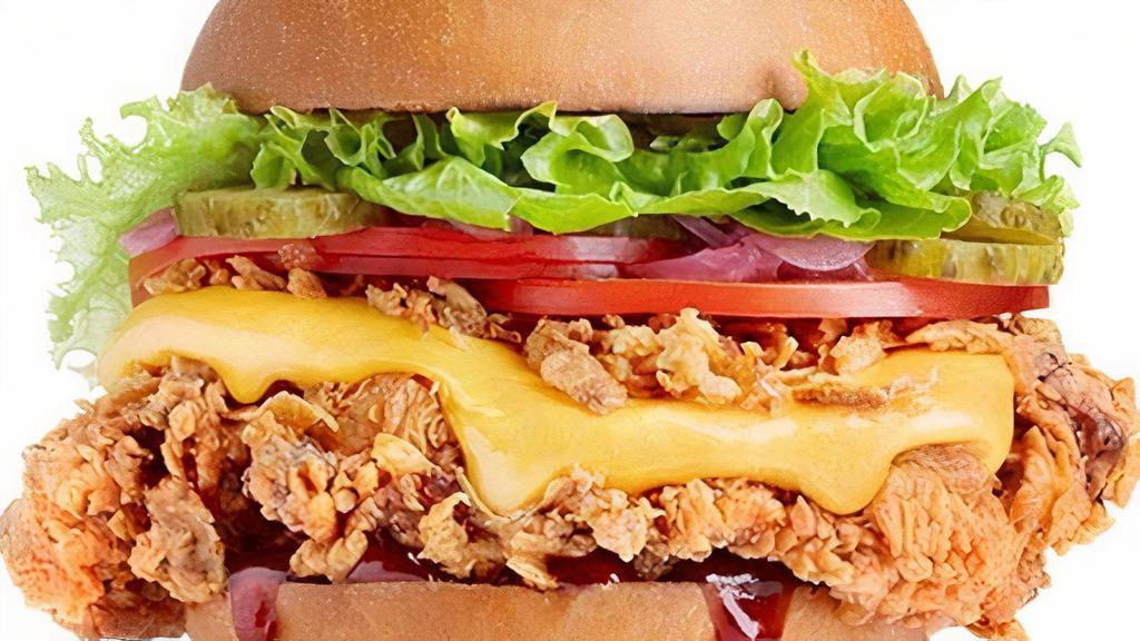 Mississippi Chicken Sandwich · Crispy / Grilled, Lettuce, tomato, cheddar cheese, Honey BBQ sauce on a brioche bun.