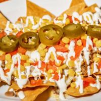 Nachos · Corn tortilla chips, beans, melted cheese, sour cream jalapeños, corn and tomato.