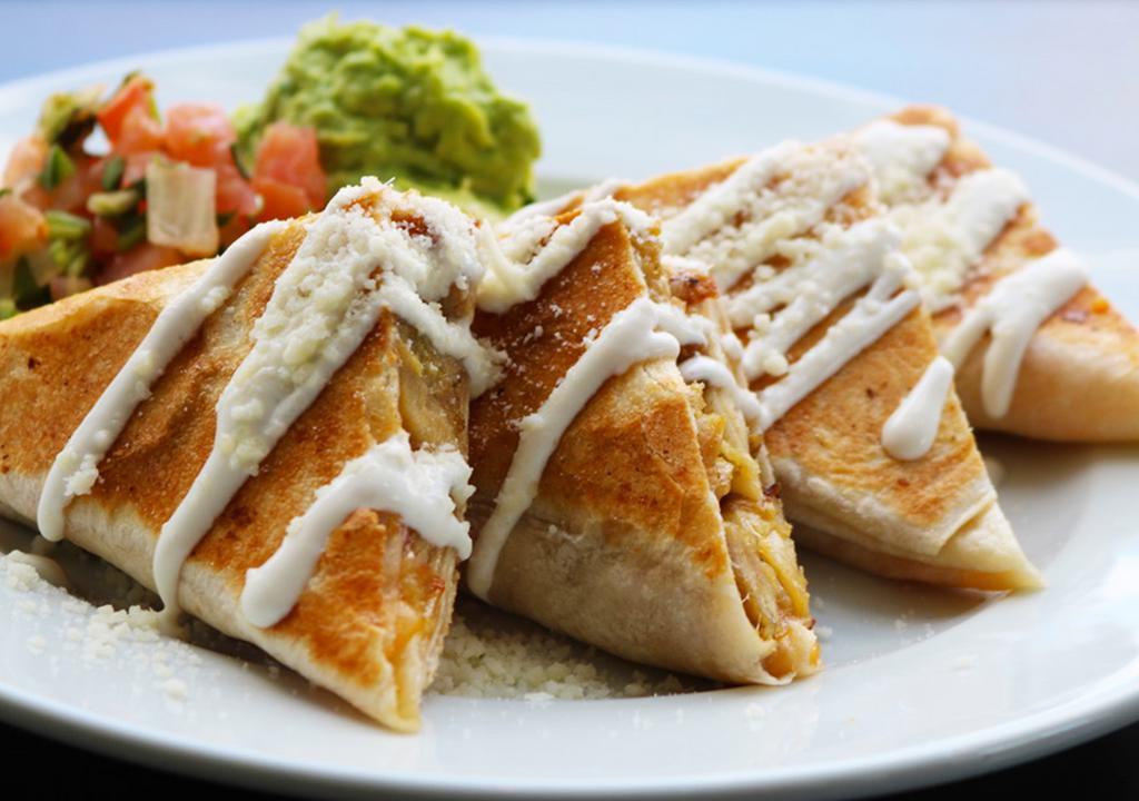 Quesadillas · Mix cheese, guacamole, pico de gallo, sour cream.