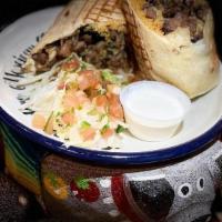 Burrito · Stuffed flour tortilla with yellow rice,. black beans, avocados, Monterrey Jack. cheese & so...