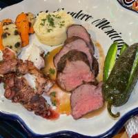 Filet Mignon Miramar · Filet mignon & grilled octopus, served. with mashed potatoes & sautéed mixed. veggies. Garni...