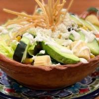 Mexican Salad · A wonderful mix of romaine lettuce,. tortilla strips, baby corn, avocado slices,. queso fres...