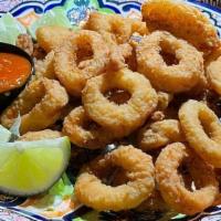 Fried Calamari · Tender pieces of calamari rings coated. in seasoned flour & deep fried to golden. brown perf...