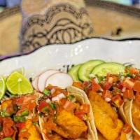 Fish Taco · Fried tilapia fish topped with pico de. gallo with side of our signature. homemade Asadero c...