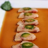 Yellowtail Jalapeño · Sliced yellowtail topped with sliced jalapeño served with ponzu sauce.