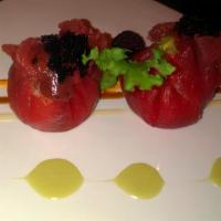 Tuna Dumpling · Mashed avocado and crab with spicy mayo crunchy wrapped inside a piece of tuna to create a d...