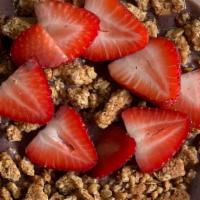 Acai Bowl · Blended Acai, Blueberries, Banana, Almond Milk.  Topped with strawberries and granola.