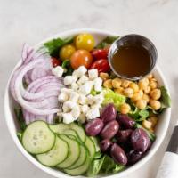 Greek Salad · Organic romaine chopped, cucumber, tomato, chickpeas, kalamata olives, feta, house made citr...