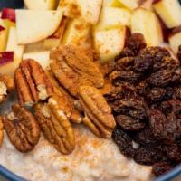 Apple Cinnamon Oatmeal · topped with red apple, raisins, pecans and cinnamon